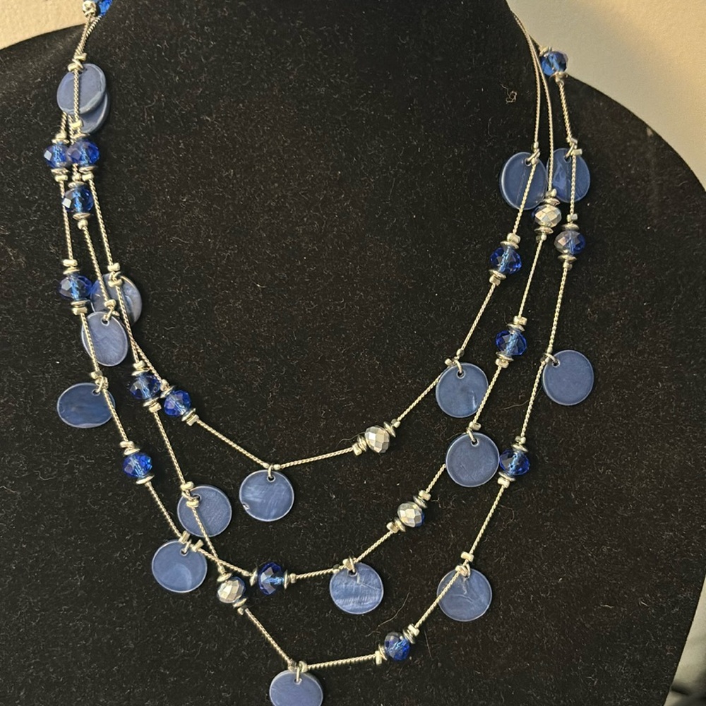 Nice multi strand silver tone necklace with blue glass and shell beads 21”